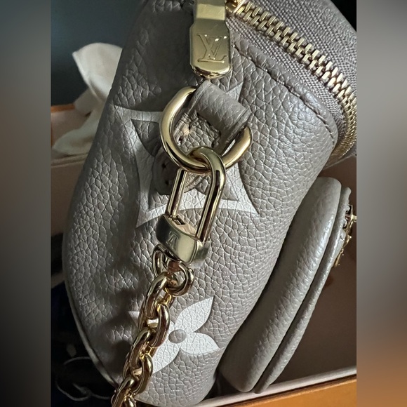 Brand new Louis Vuitton mini bumbag in bicolor monogram empreinte leather. - Picture 13 of 16